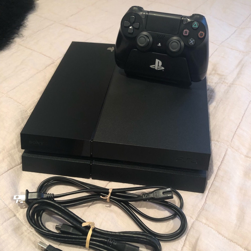 PS4 First Generation with controller and cords included.